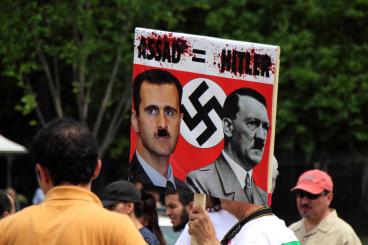 Al Assad compared to Hitler by Protester